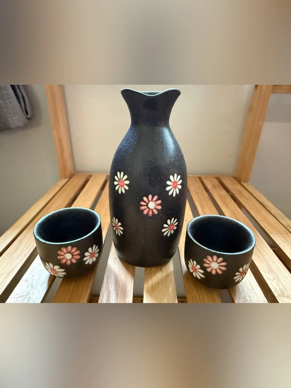 Black Ceramic Floral Sake Set with Pink and White Daisy Accents